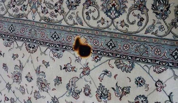 سوختگی فرش با زغال